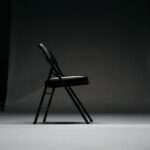 black metal framed padded folding chair