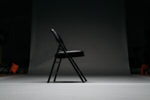 black metal framed padded folding chair